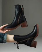 Valorine™ | Black leather boots with a comfortable heel, elegant and timeless.