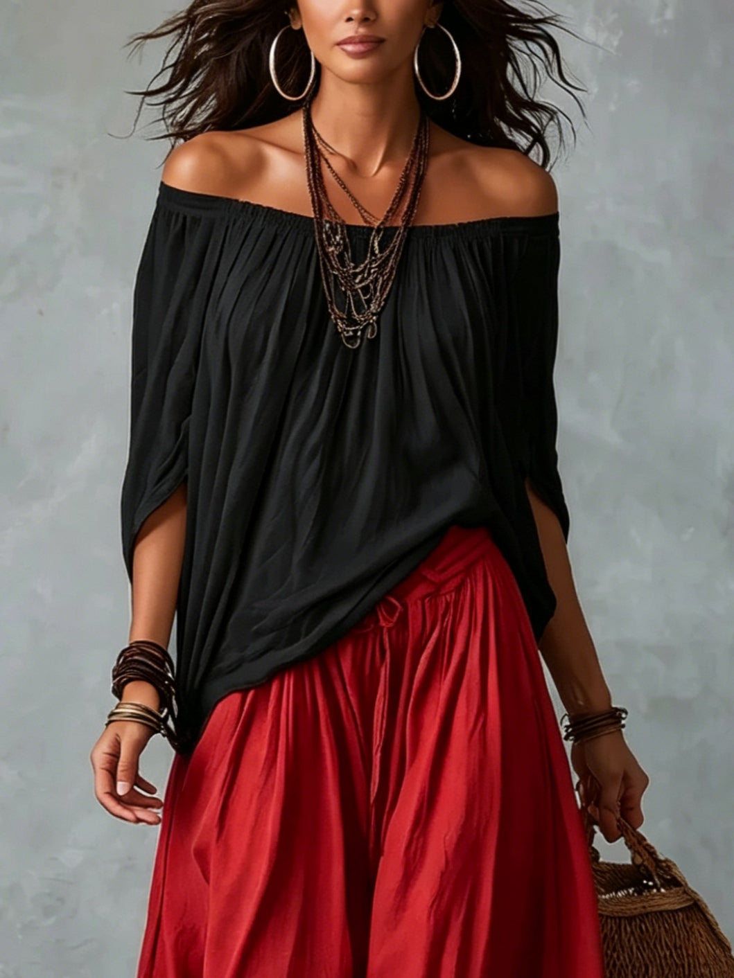 Ensemble haut noir à épaules dénudées et pantalon lanterne ample rouge